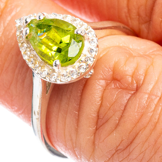 925 sterling silver ring with green peridot-style oval center stone and cubic zirconia halo