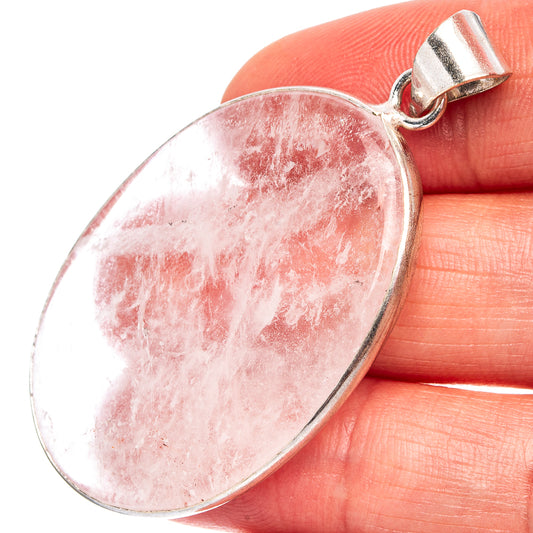 Oval pink selenite pendant with silver-plated loop bail