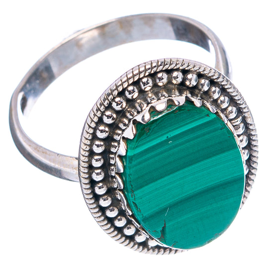 Oval green malachite cabochon sterling silver ring with textured bezel and scalloped edge