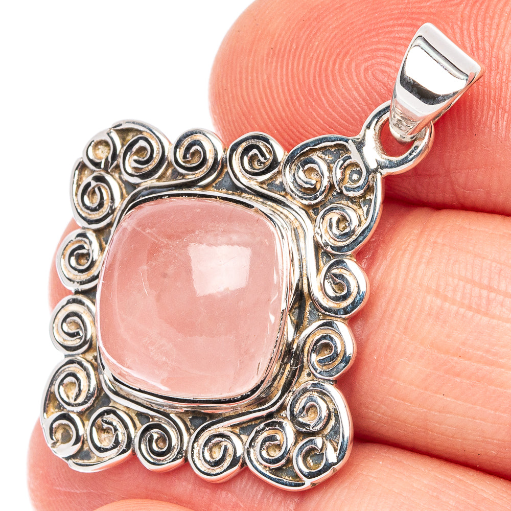 Rose quartz pendant with oval pink cabochon in ornate 925 sterling silver filigree bezel