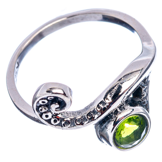 Sterling silver wave ring with peridot-green round gemstone and openwork band, size 6.5