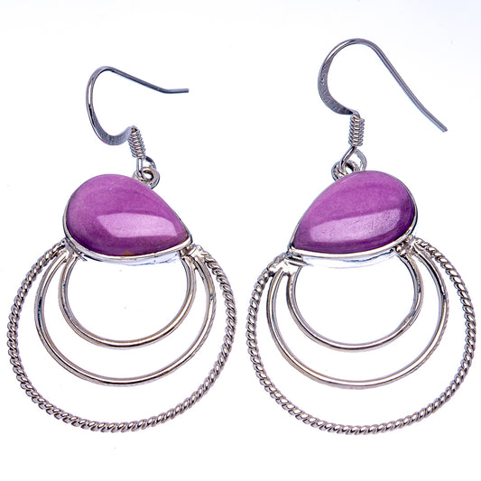 Pair of sterling silver earrings with purple teardrop stones, hoop tiers, and chain accents