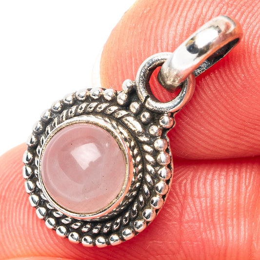 Oval rose quartz pendant close-up with .925 sterling silver prong setting and bail