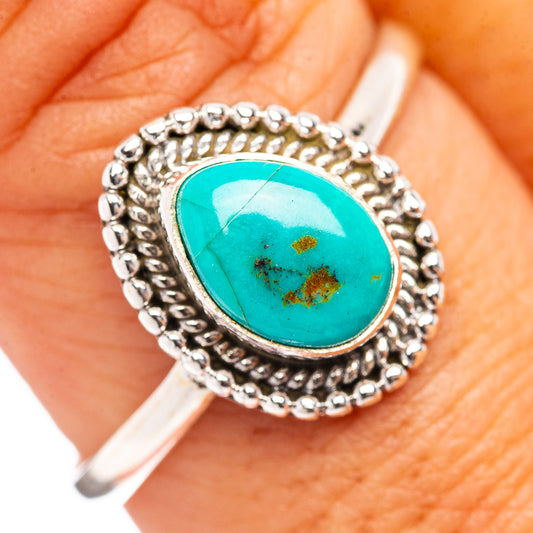 Turquoise cabochon ring in silver rope-style bezel with beaded edge detail