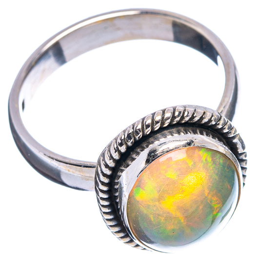 Sterling silver Ethiopian opal ring, oval iridescent green-orange center, rope band
