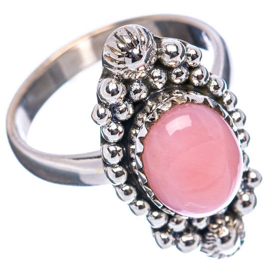 Sterling silver ring with pink oval opal and raised beaded frame