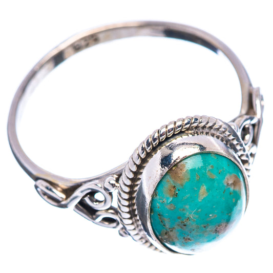 Turquoise cabochon sterling silver ring with braided rope-style frame, side view