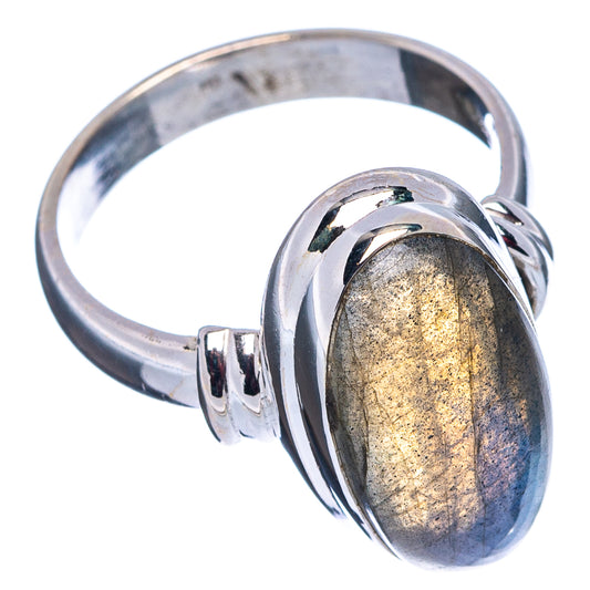Polished sterling silver ring with oval labradorite, angled view of band and bezel