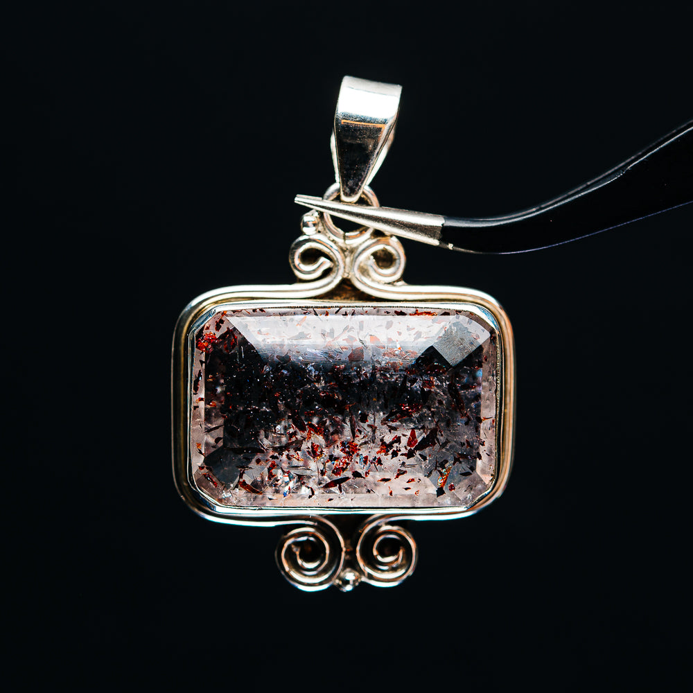 Sterling silver rectangular lepidocrocite pendant with filigree swirls and faceted stone