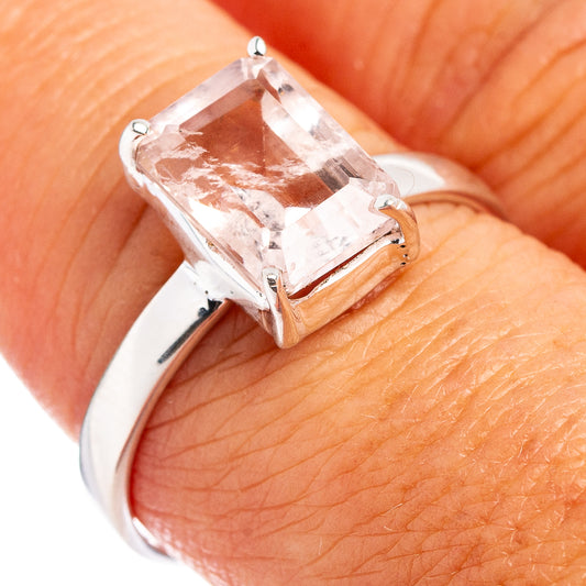 Sterling silver ring with square-cut pink gemstone, close-up on band