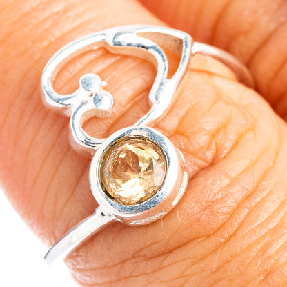 Adjustable sterling silver ring with heart cutout and round citrine gemstone