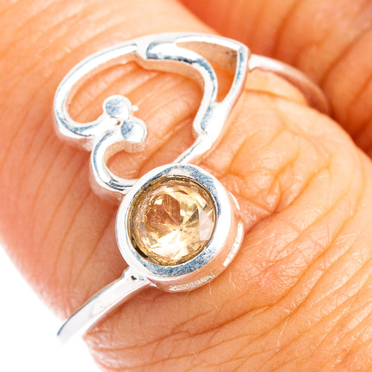 Adjustable sterling silver ring with heart cutout and round citrine gemstone