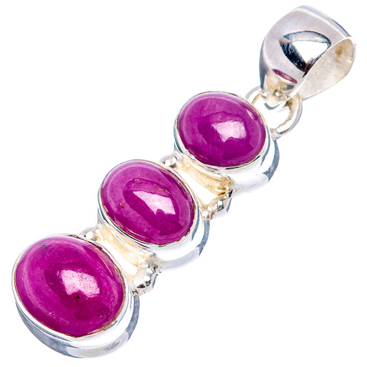 Three-stone sterling silver pendant with three purple cabochon gemstones and top bail