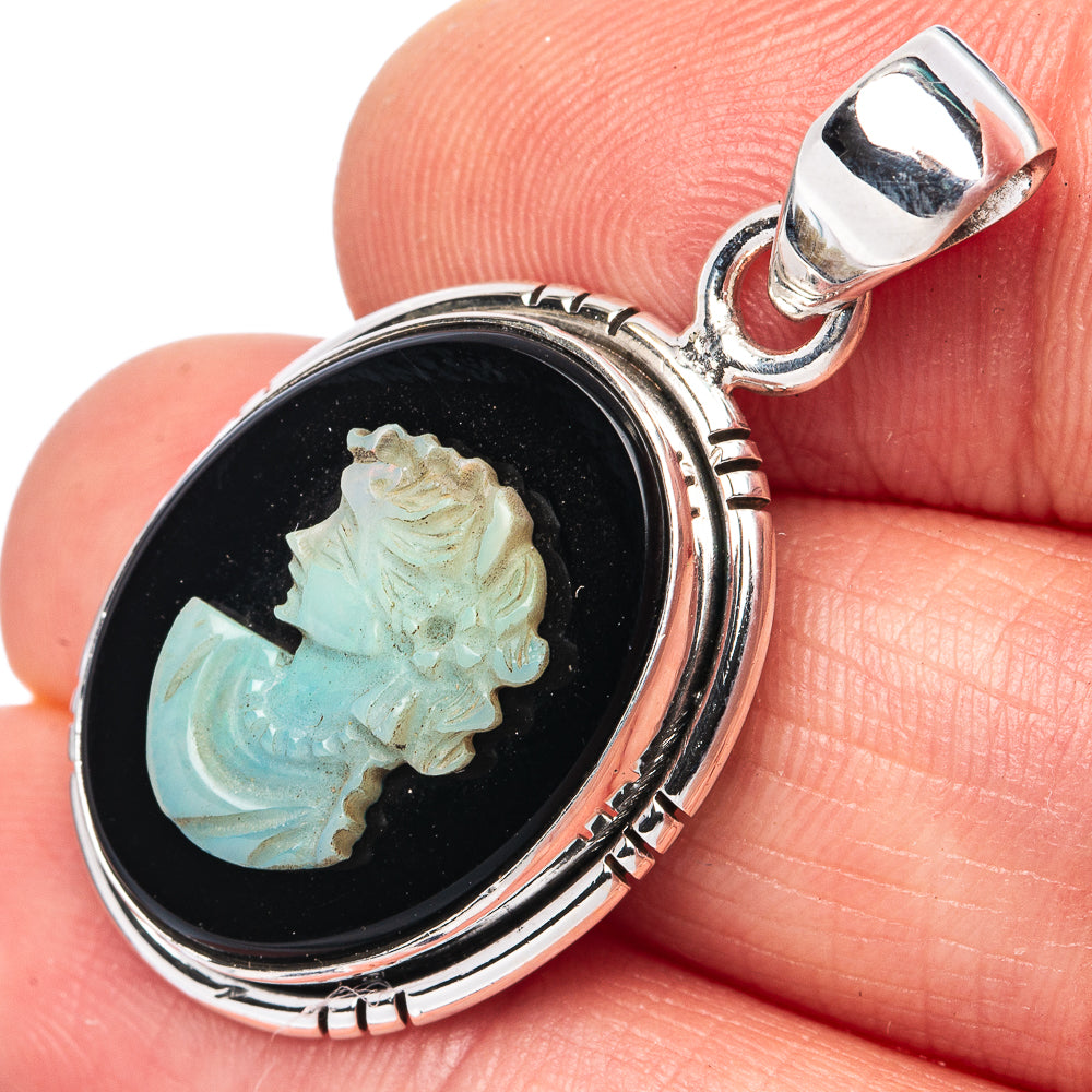 Oval sterling silver opal cameo pendant with lady face in black setting