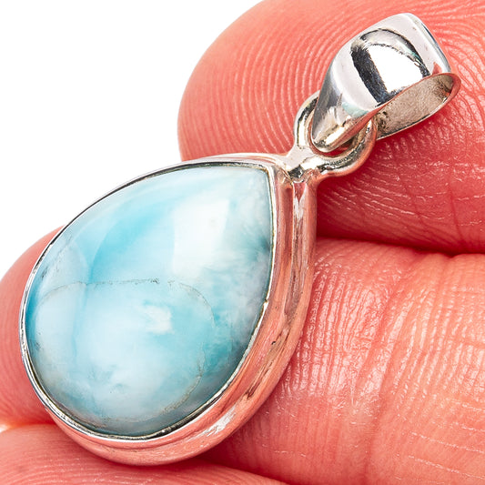 Larimar teardrop pendant in silver setting, close-up light blue stone