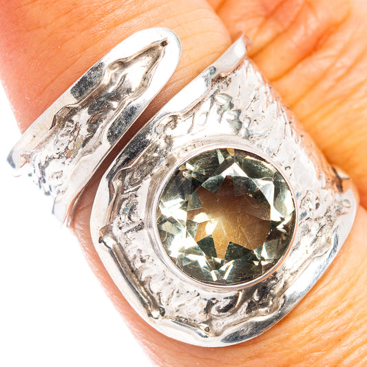 Silver adjustable amethyst ring with oval green faceted gemstone and ornate halo setting