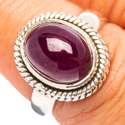 Sterling silver ring with oval purple ruby and rope-like bezel, size 6.75