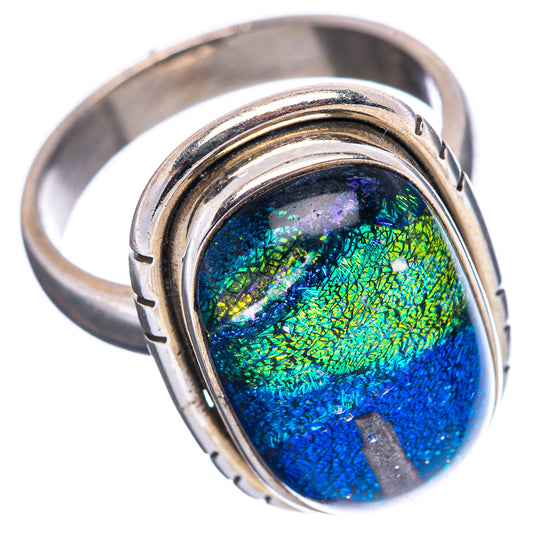 Sterling silver oval ring with iridescent blue-green dichroic glass and bezel