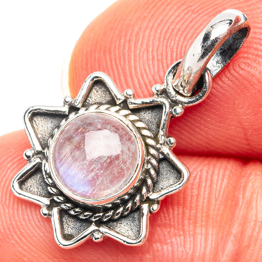 Sterling silver moonstone pendant with round pink iridescent cabochon in star setting