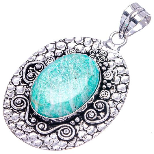 Amazonite oval pendant featuring turquoise cabochon in detailed silver-tone frame