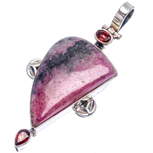 Rhodonite teardrop pendant, .925 sterling silver setting with two red garnet stones
