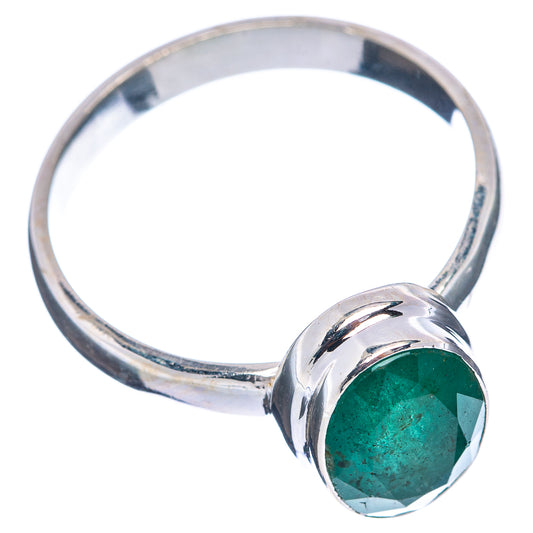 Sterling silver ring with faceted green emerald, round bezel setting