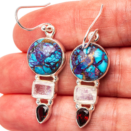 Sterling silver drop earrings with round blue-purple turquoise cabochons and red accent stones