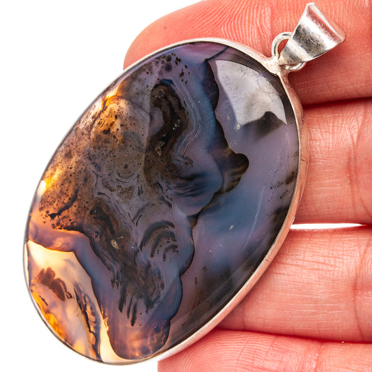 Silver-plated agate pendant, teardrop cabochon with blue, purple, and orange pattern
