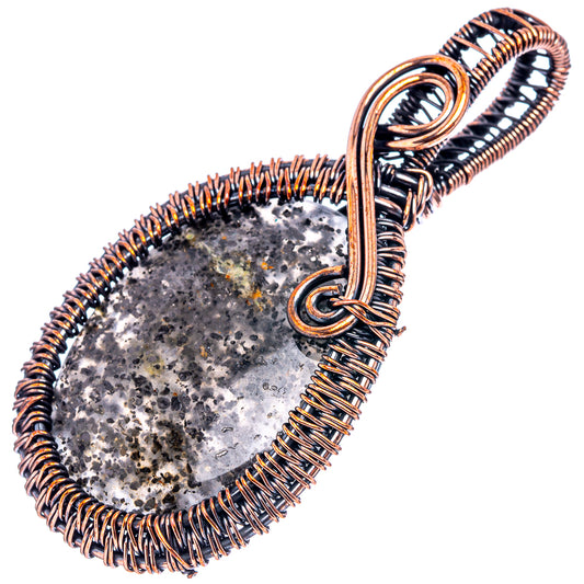 Oxidized copper wire-wrapped pendant with dark sunstone teardrop center and bail