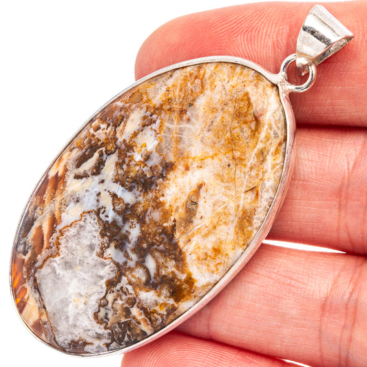 Silver-plated lace agate oval pendant with orange, brown, and white stone, top bail