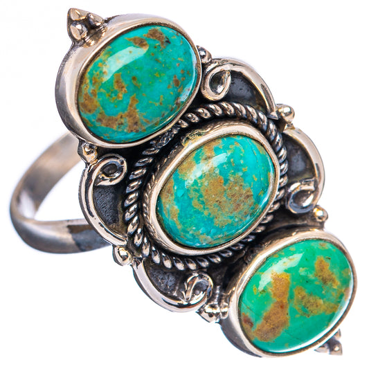 Three-stone sterling silver ring with round turquoise cabochons and sculpted scrollwork