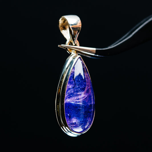 Sterling silver tanzanite pendant with teardrop blue-violet gemstone, side view