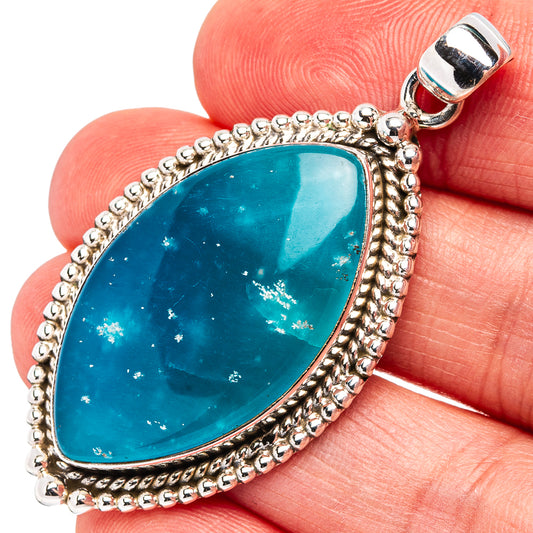Turquoise teardrop pendant in .925 sterling silver with beaded border and bail
