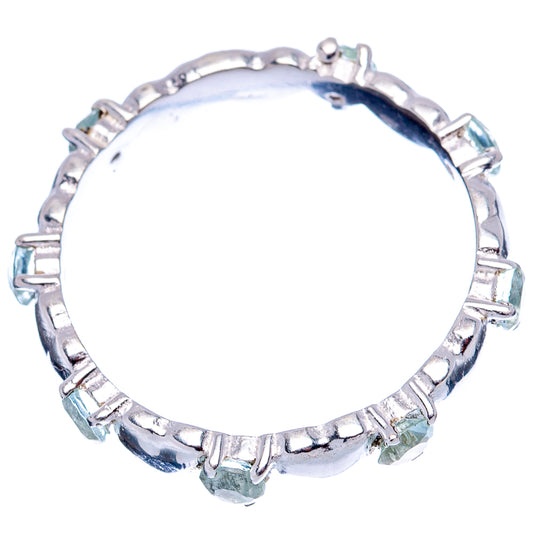 Sterling silver ring with oval blue topaz stones set around a round band