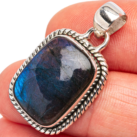 Sterling silver labradorite pendant with dark blue oval stone and rope bezel