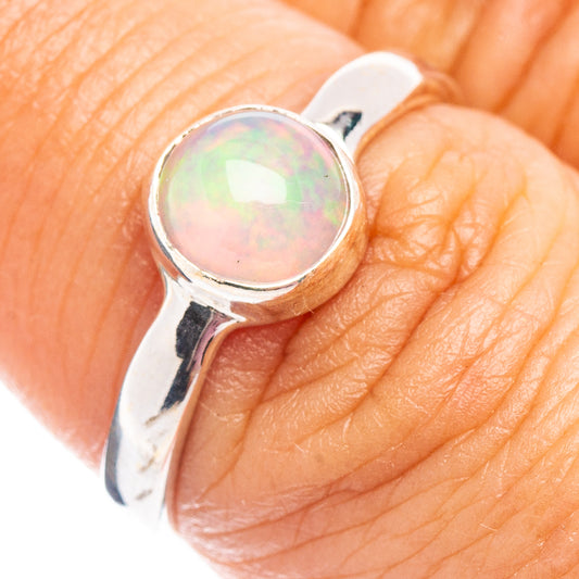 Sterling silver opal ring with oval Ethiopian opal, side bezel and band