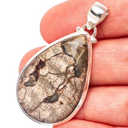 Teardrop rhyolite pendant with .925 sterling silver bezel and bail