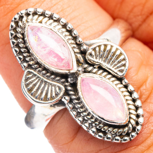 Sterling silver ring with two pink oval moonstone cabochons and scalloped settings