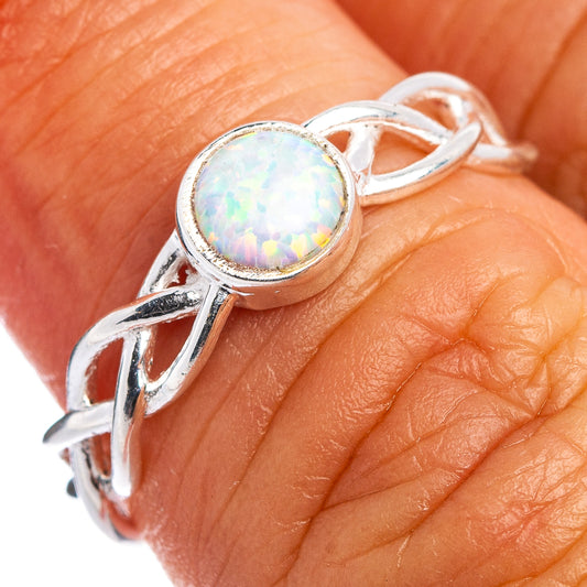 Sterling silver opal ring on hand, round opal with prong setting and split band