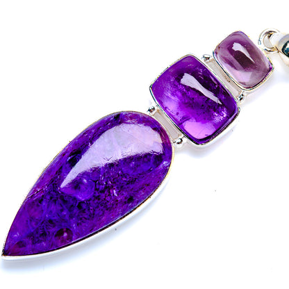 Amethyst 925 sterling silver pendant featuring long teardrop cabochon and two purple accents