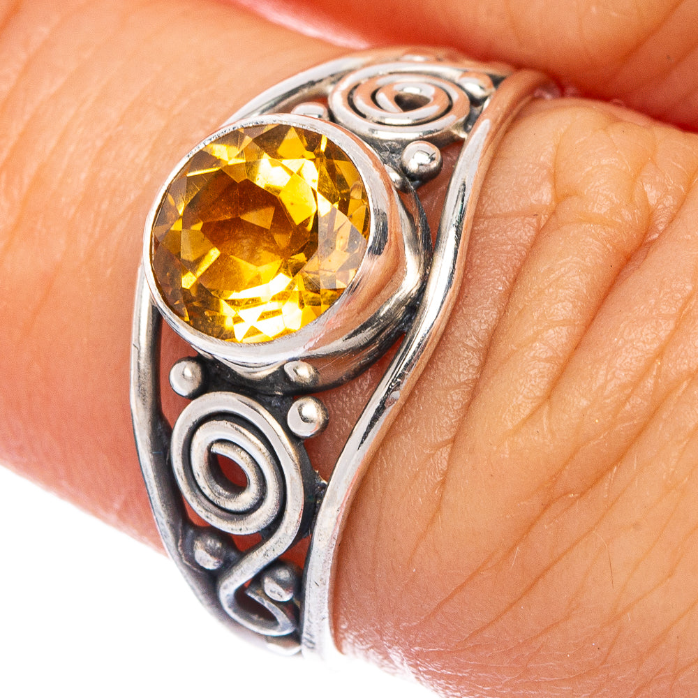 Sterling silver dainty ring with faceted oval citrine gemstone and ornate scroll setting