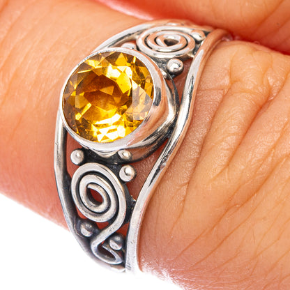 Sterling silver dainty ring with faceted oval citrine gemstone and ornate scroll setting