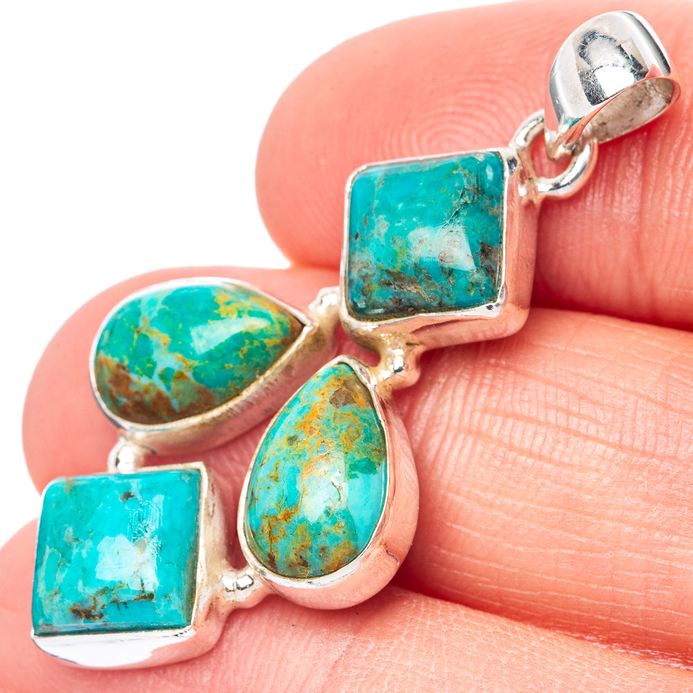 Sterling silver turquoise pendant with rectangular, oval, and pear stones.