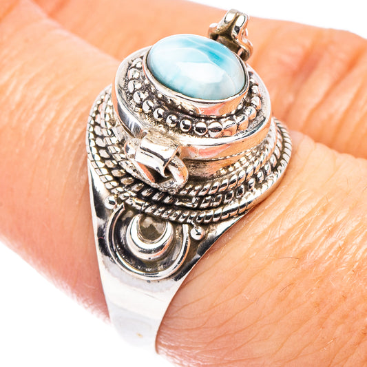 Sterling silver poison ring with oval blue larimar cabochon and detailed metal band