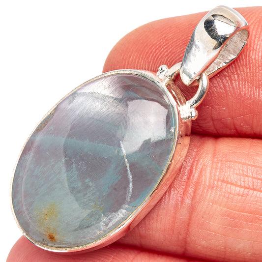 Oval aquamarine pendant in .925 sterling silver bezel with loop bail