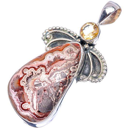 Heart-shaped crazy lace agate pendant with scalloped sterling silver settings and yellow citrine