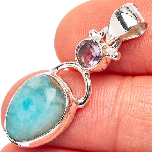 Sterling silver pendant with oval Larimar and a round pink gemstone accent