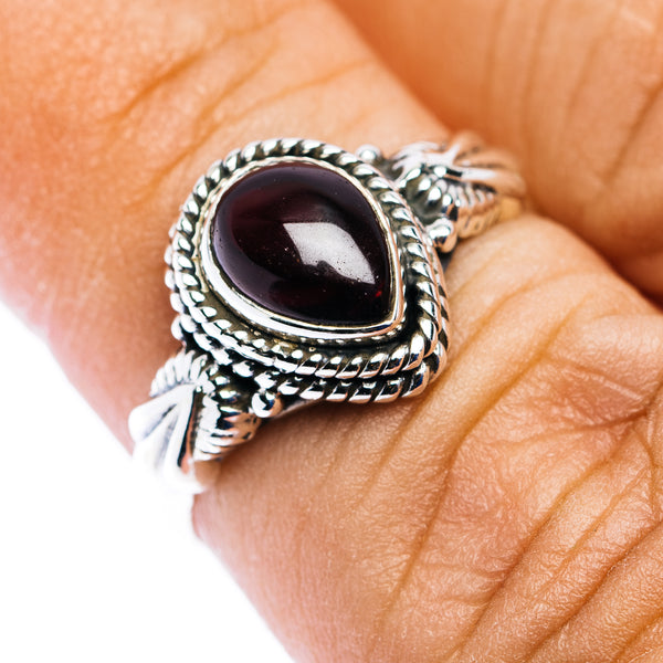 Sterling silver dainty ring, oval dark red garnet with ornate rope bezel