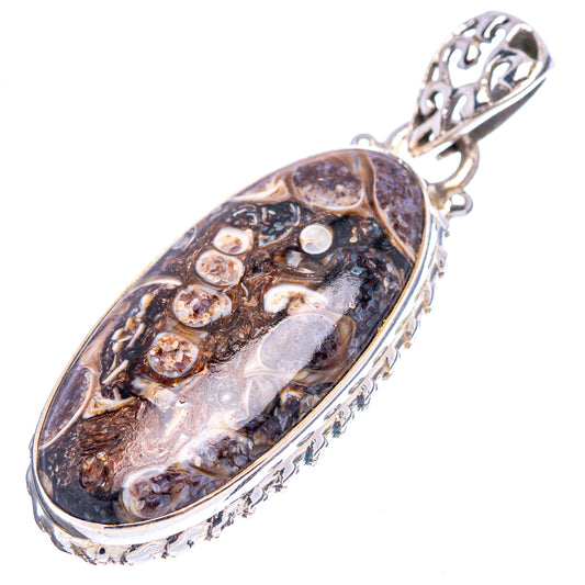Sterling silver turritella agate pendant with oval stone and carved metal top