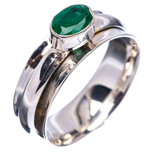 Sterling silver spinner ring angled view, oval green gemstone set in bezel